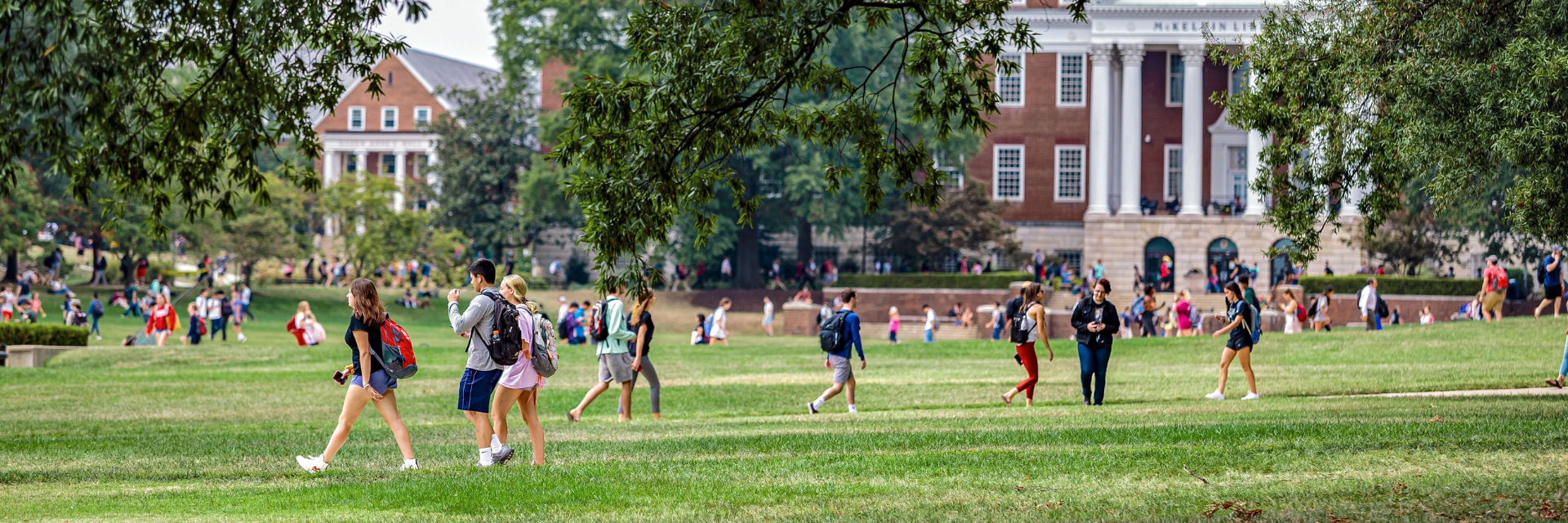 students walking on lawn